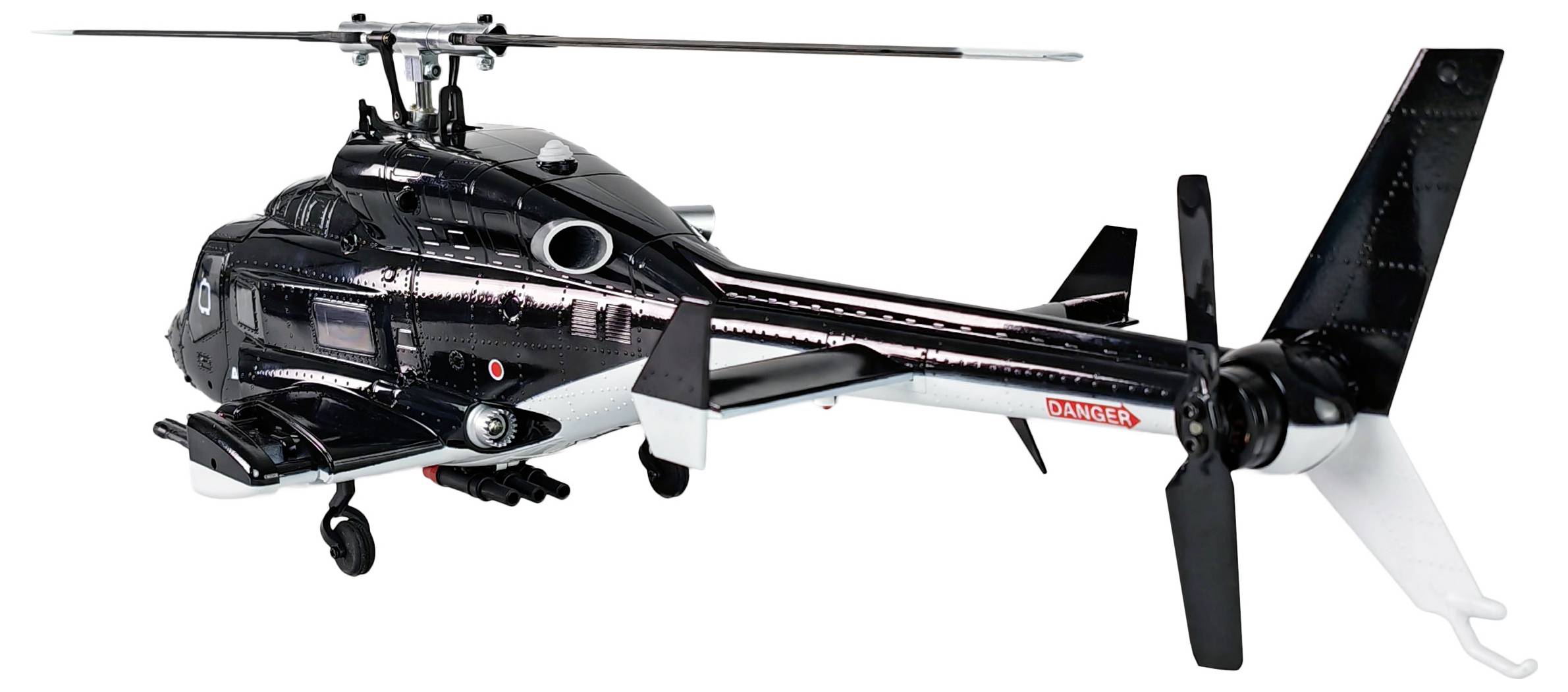 Detaljan model crnog vojnog helikoptera s vidljivim pokretnim landing gearom, repnim rotorom i malim naoružanjem pričvršćenim ispod tijela.
