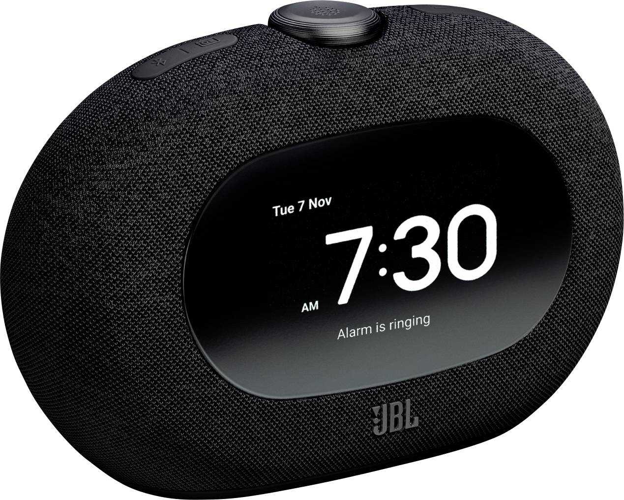 Crni digitalni budilnik s tekstilnim vanjskim slojem prikazuje '7:30 ujutro' i 'Alarm zvoni' u utorak, 7. studenog.