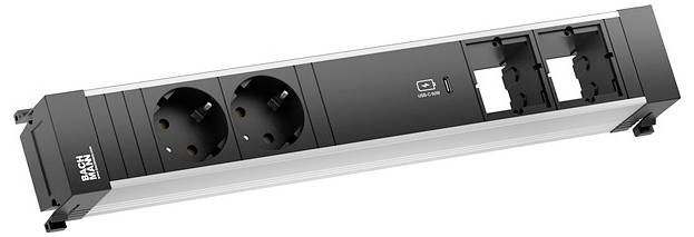 Razdjelnik sa dvije europske utičnice, USB portom i dva mjesta za dodatne module. Crni i srebrni dizajn, brenda 'BACHMANN'.