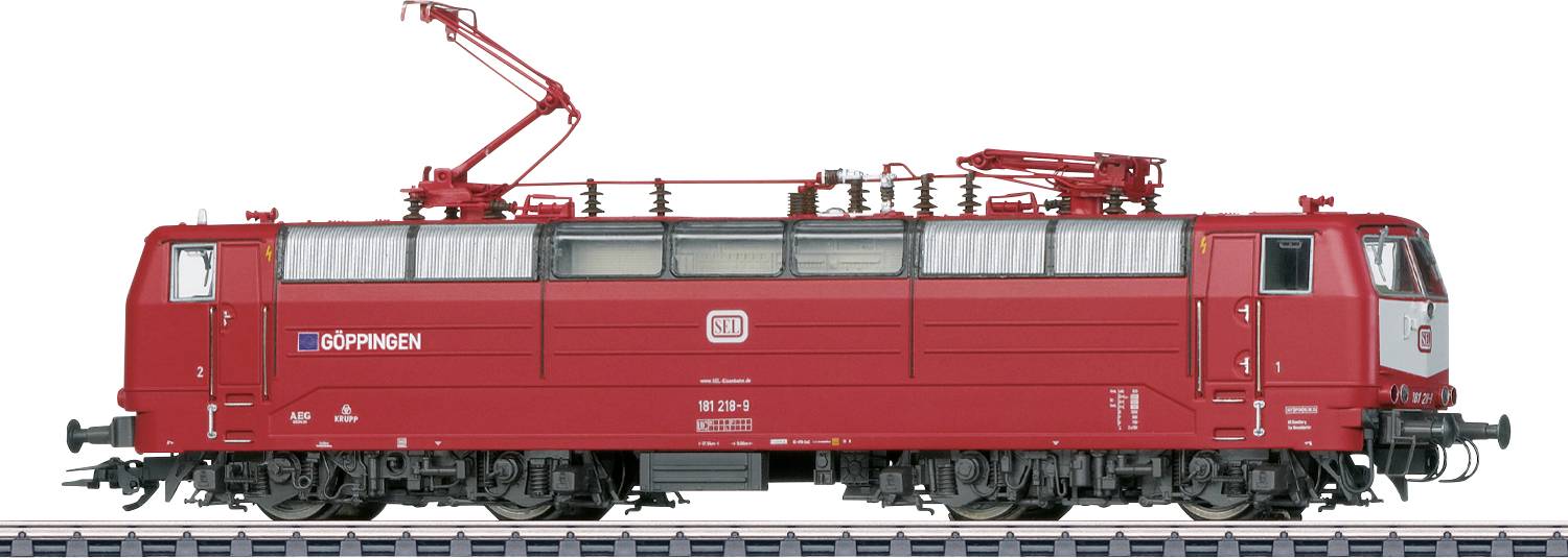 Crveni željeznički model vlaka s detaljnim značajkama i malim tekstom 'ÖBBPINKEN' na boku, postavljen na tračnice.