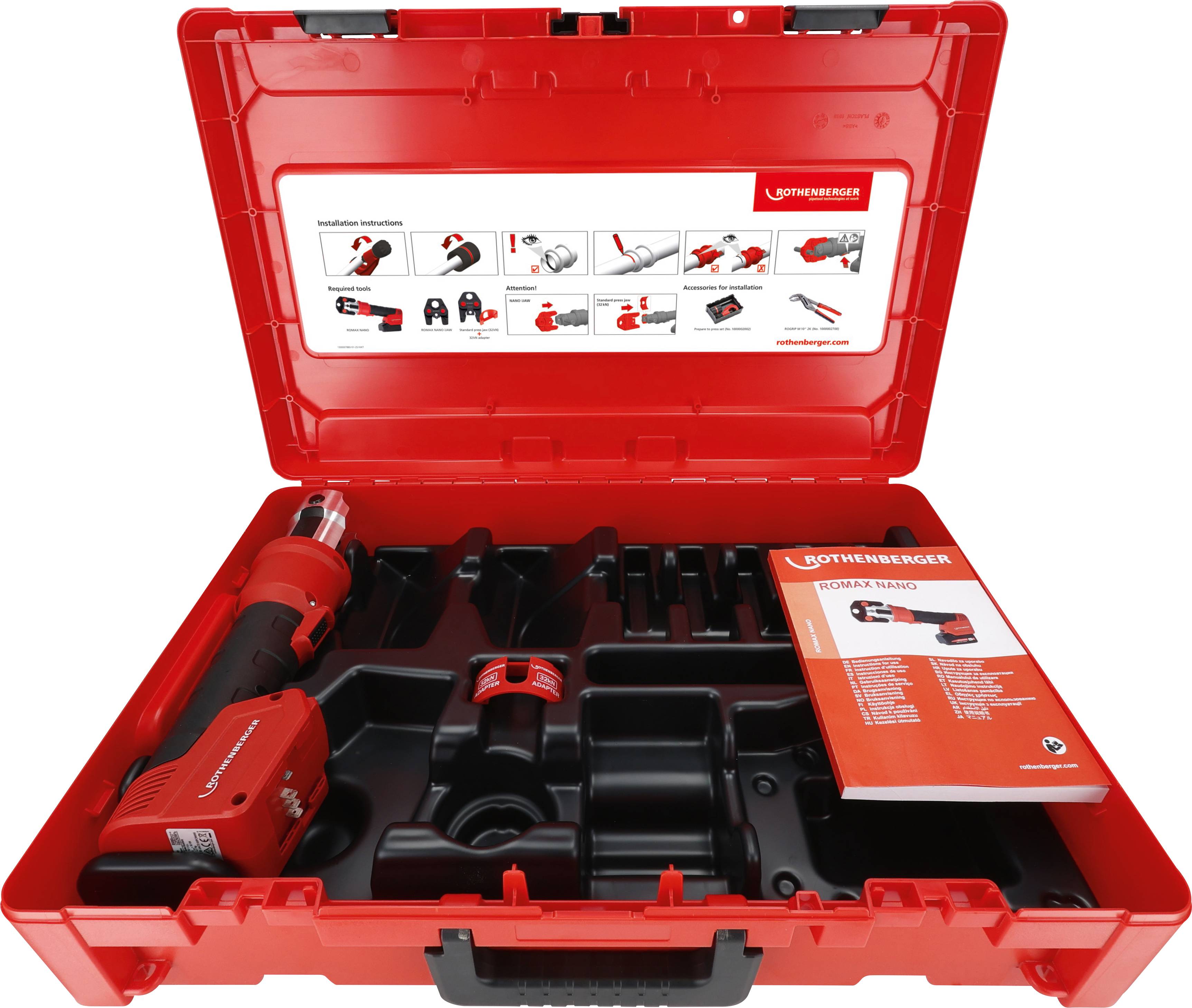 'Otvoreni crveni transportni kofer s elektromehaničkim alatom, dodatnom opremom i uputstvom. Komponente organizirane u pretincima.'