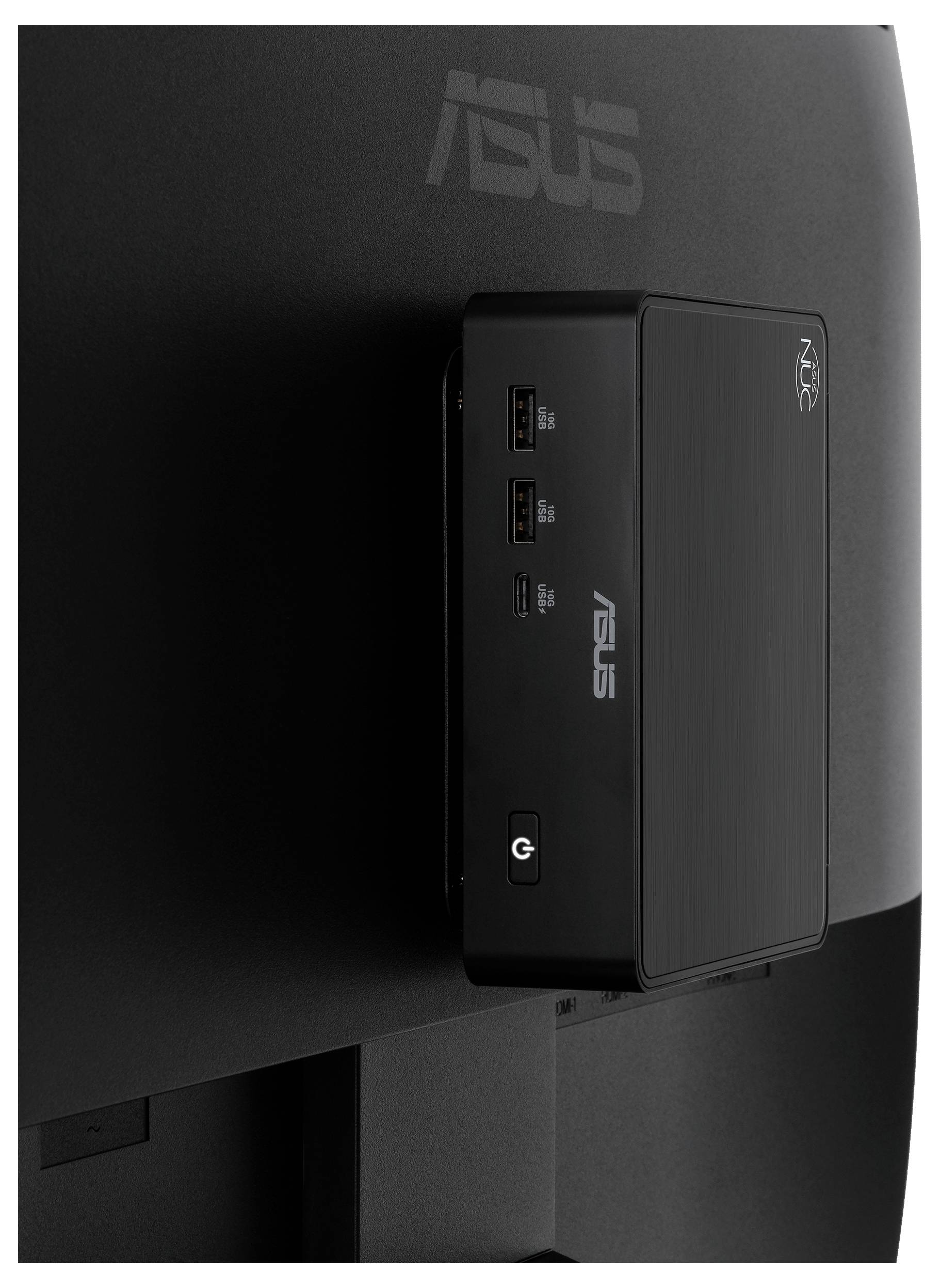 Stražnja strana ASUS računalnog monitora s montiranom crnom ASUS mini PC jedinicom ili dokingom priključenom na nju.
