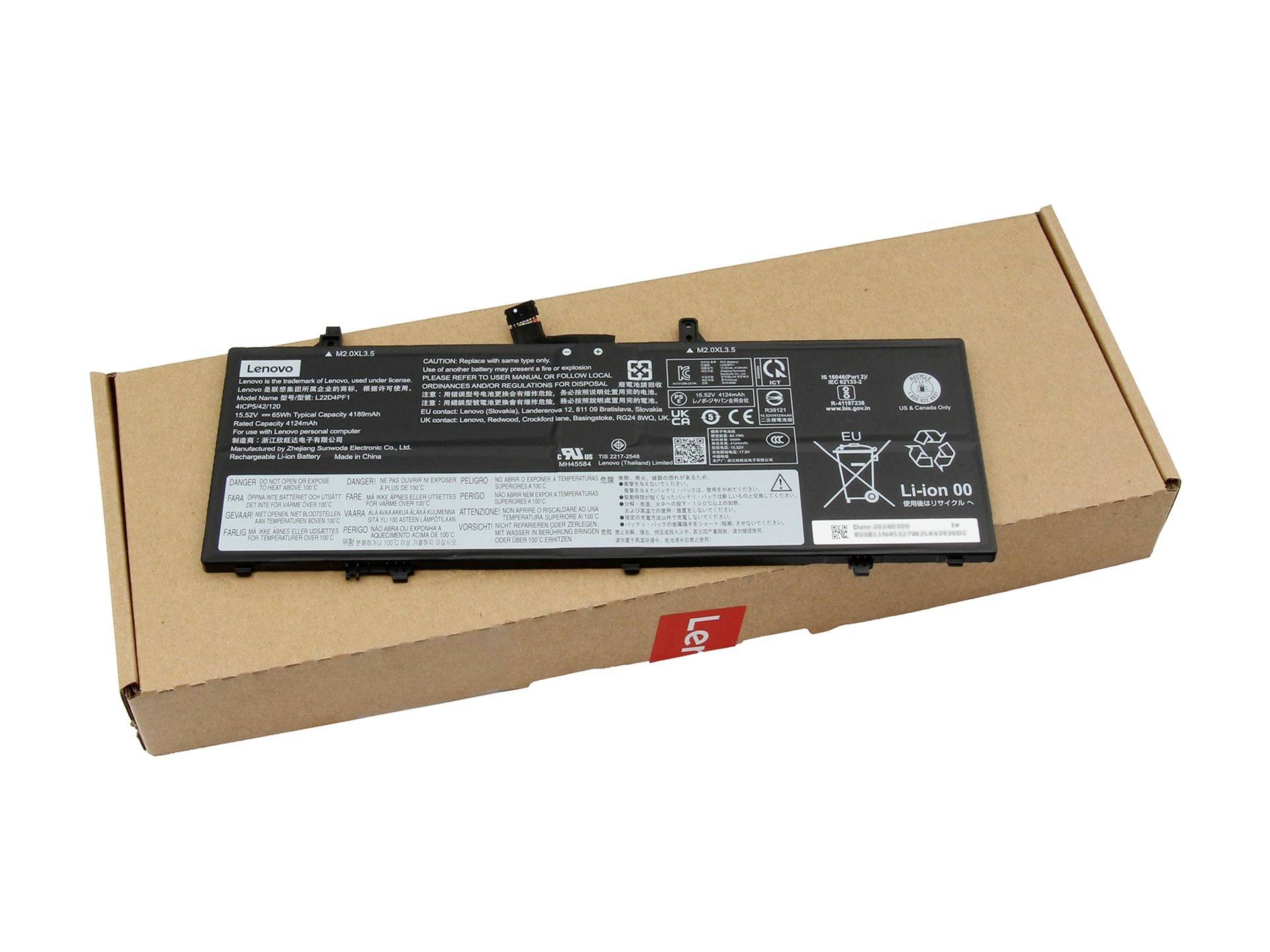 Baterija Lenovo prijenosnog računala koja leži na kartonskoj kutiji, promatrana odozgo.