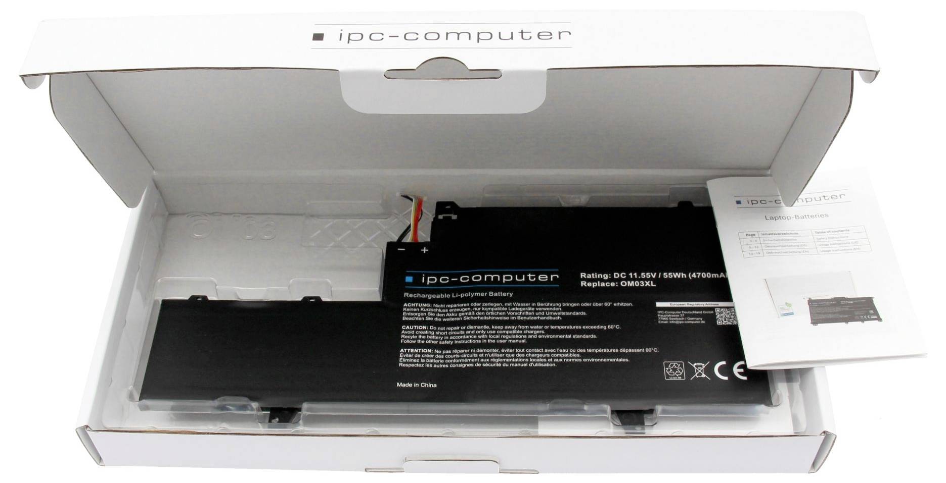 Otvorena kutija bijele boje koja sadrži bateriju IPC-Computer i papire na bijeloj pozadini.