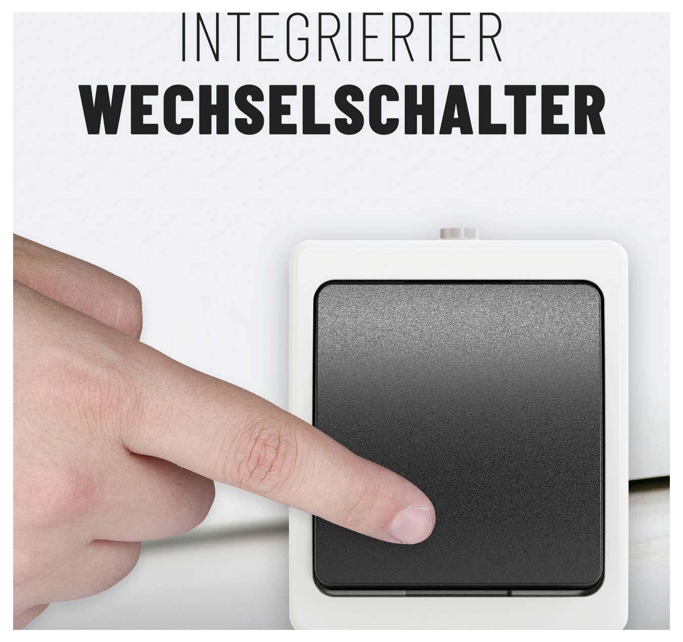 Prst koji pritiska zidni prekidač označen sa 'INTEGRIERTER WECHSELSCHALTER'.