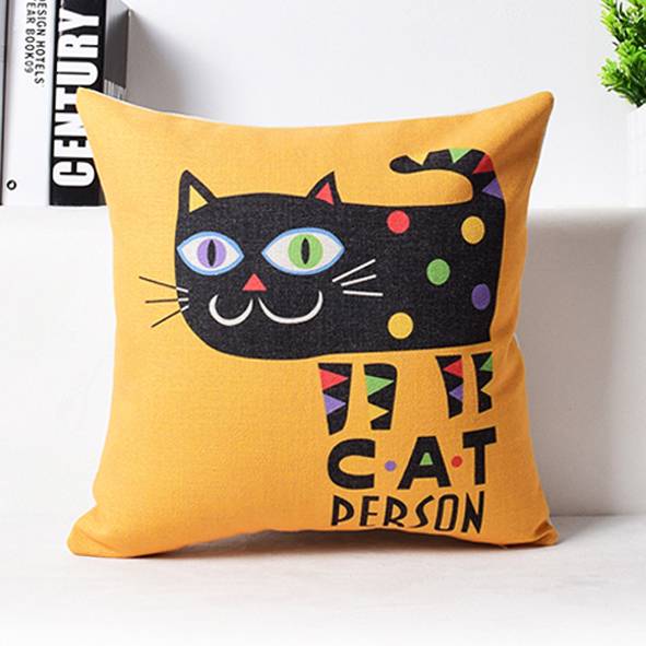 Narančasti dekorativni jastuk s grafikom crne mačke i natpisom 'CAT PERSON' na prednjoj strani.