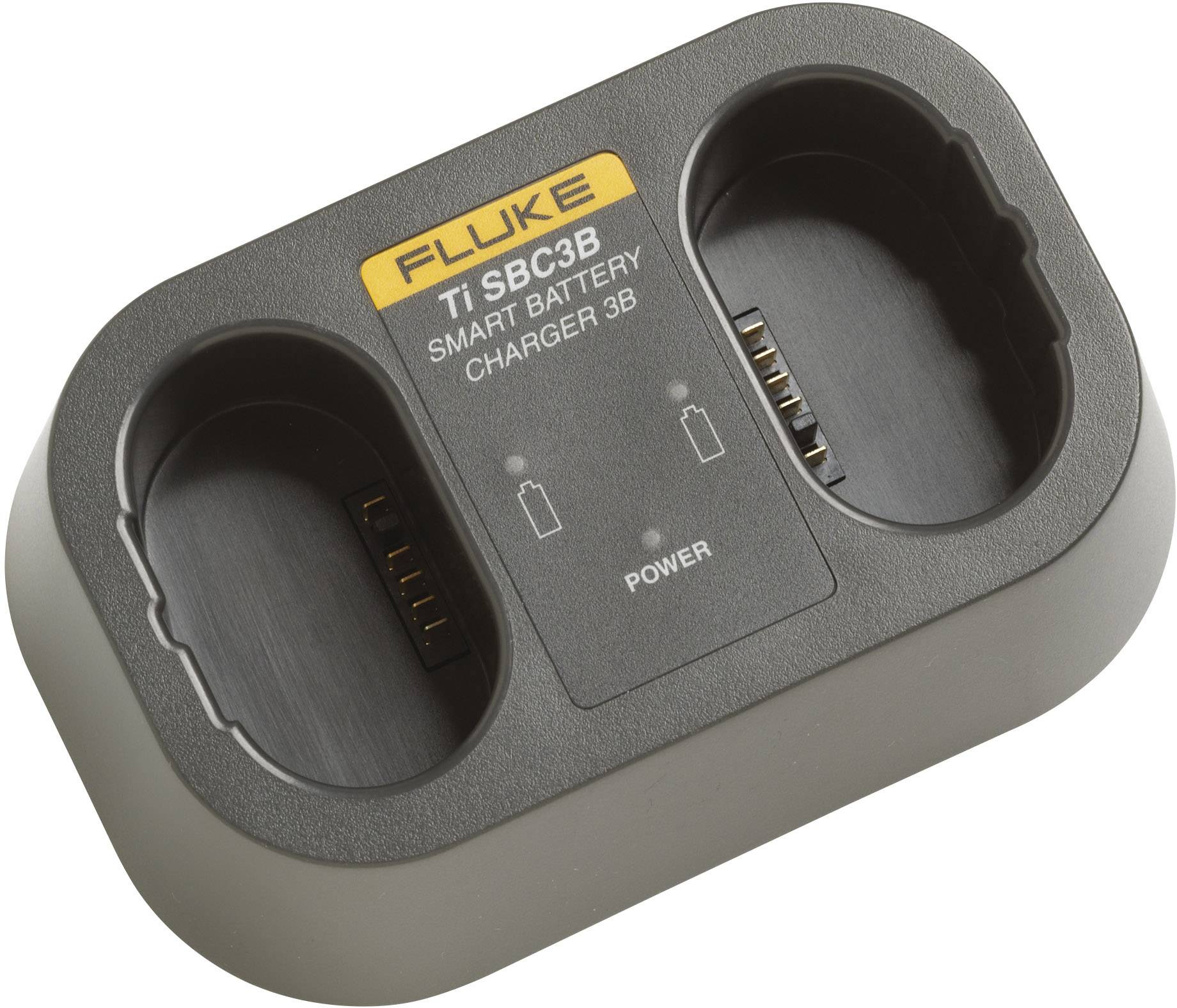 Punjač baterija s dva mjesta za punjenje, označen natpisom 'Fluke Ti SBC3B Smart Battery Charger'. Prikazuje indikatore statusa za napredak punjenja.