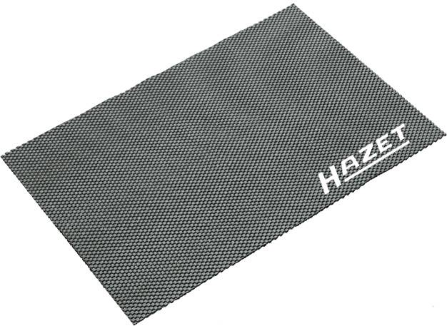 Siva protuklizna prostirka s bijelim logotipom 'Hazet' u kutu. Pruža sigurno i stabilno prianjanje na različitim površinama.