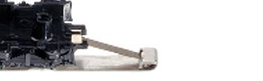 Crna mehanička komponenta s srebrnom polugom ili zasunom s lijeve strane slike. Njen precizan namjenski cilj nije jasan.
