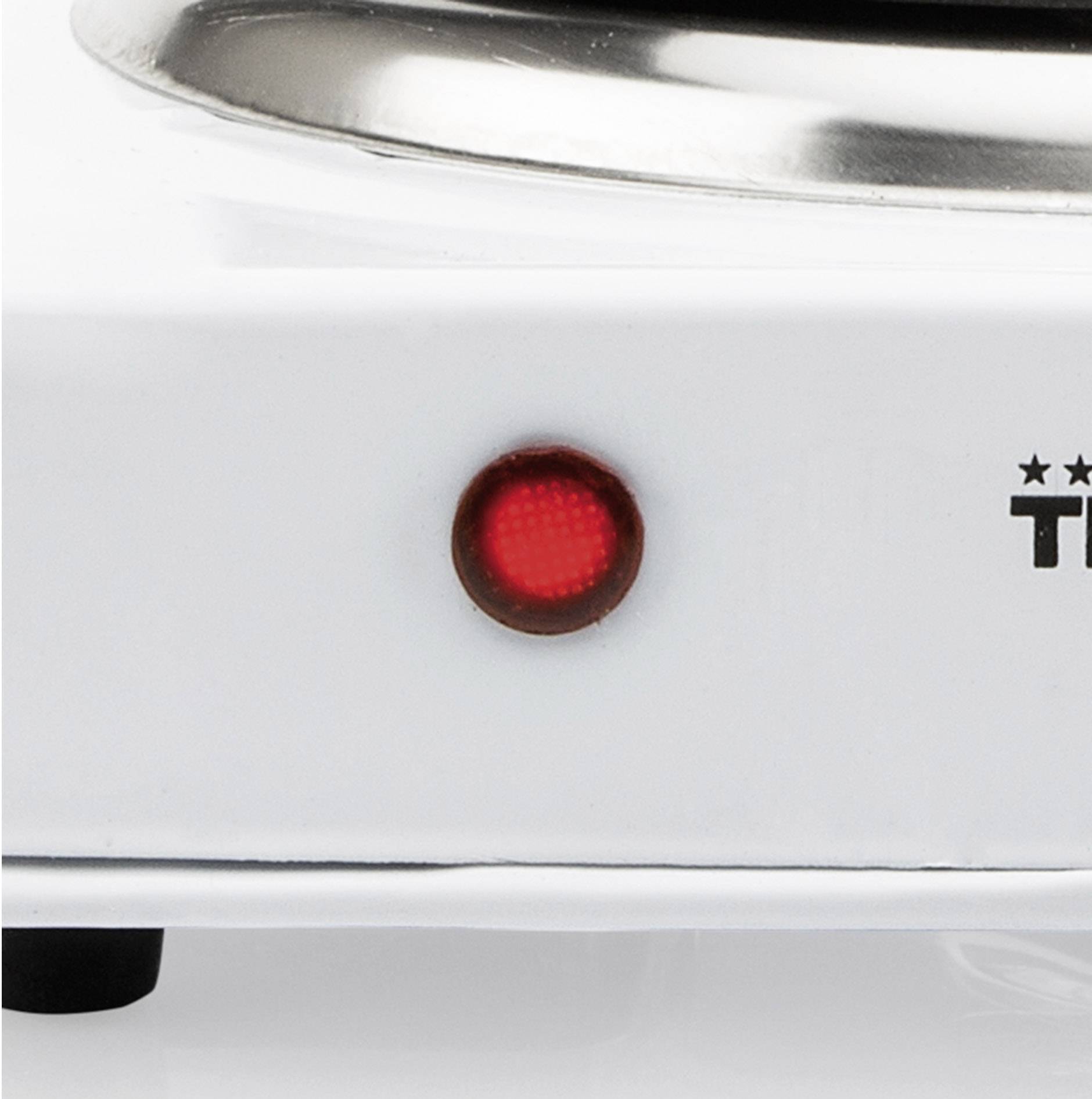 Crvena kontrolna lampica na bijelom električnom uređaju pokazuje trenutno stanje rada.