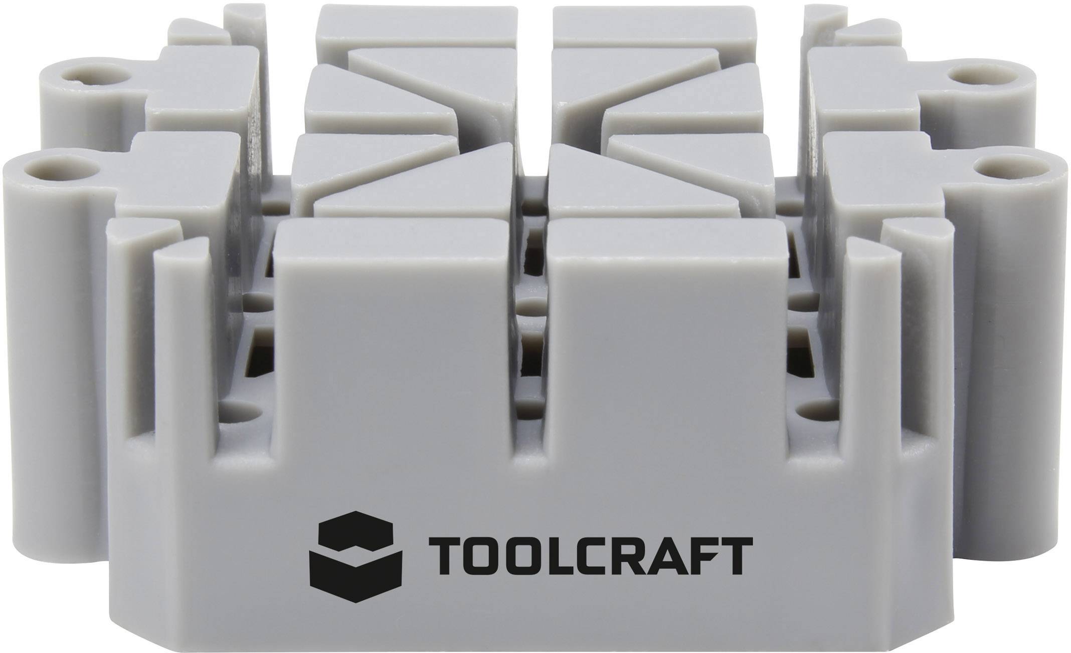 Sivi nosač alata izrađen od plastike s natpisom 'TOOLCRAFT'; namijenjen čuvanju i organizaciji alata.