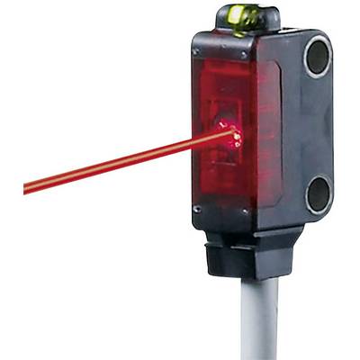 Crveni laserski zrak izbija iz pravokutnog senzorskog uređaja pričvršćenog na bijeli kabel.