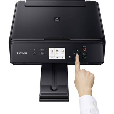Crno-bijeli Canon printer s dodirnim zaslonom. Ruka pokazuje na tipku 'OK'.