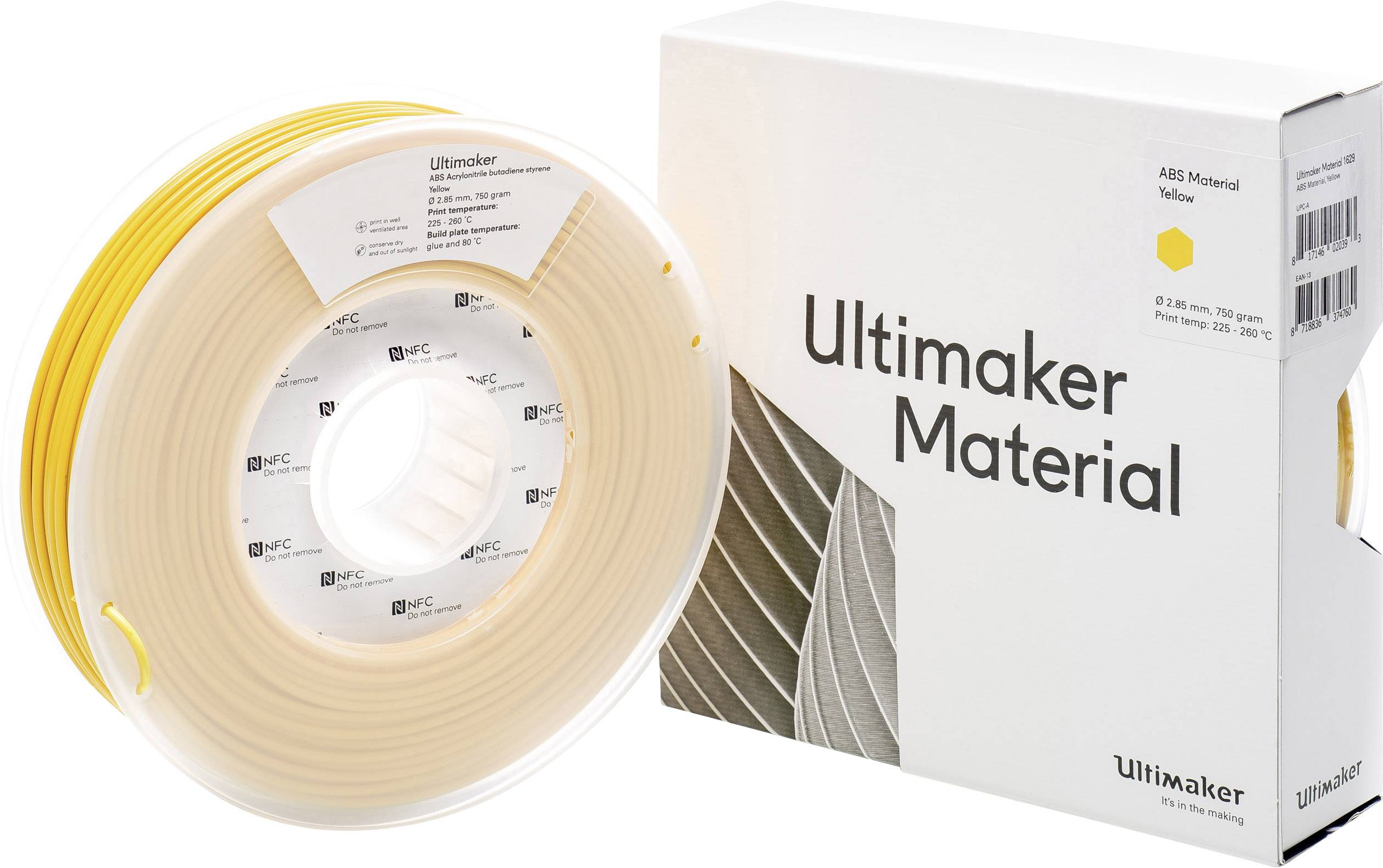 Žuta Ultimaker-špula materijala pored bijele kartonske kutije s natpisom 'Ultimaker materijal'.