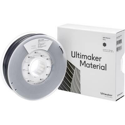 3D pisač filament tvrtke Ultimaker u sivoj boji, namotान na rolnu, pored kutije s podacima proizvođača i detaljima filamenta.