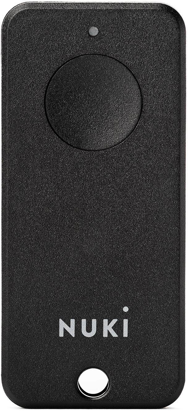 Crni, pravokutni Nuki Bluetooth privjesak s okruglim gumbom i rupom na donjem rubu.