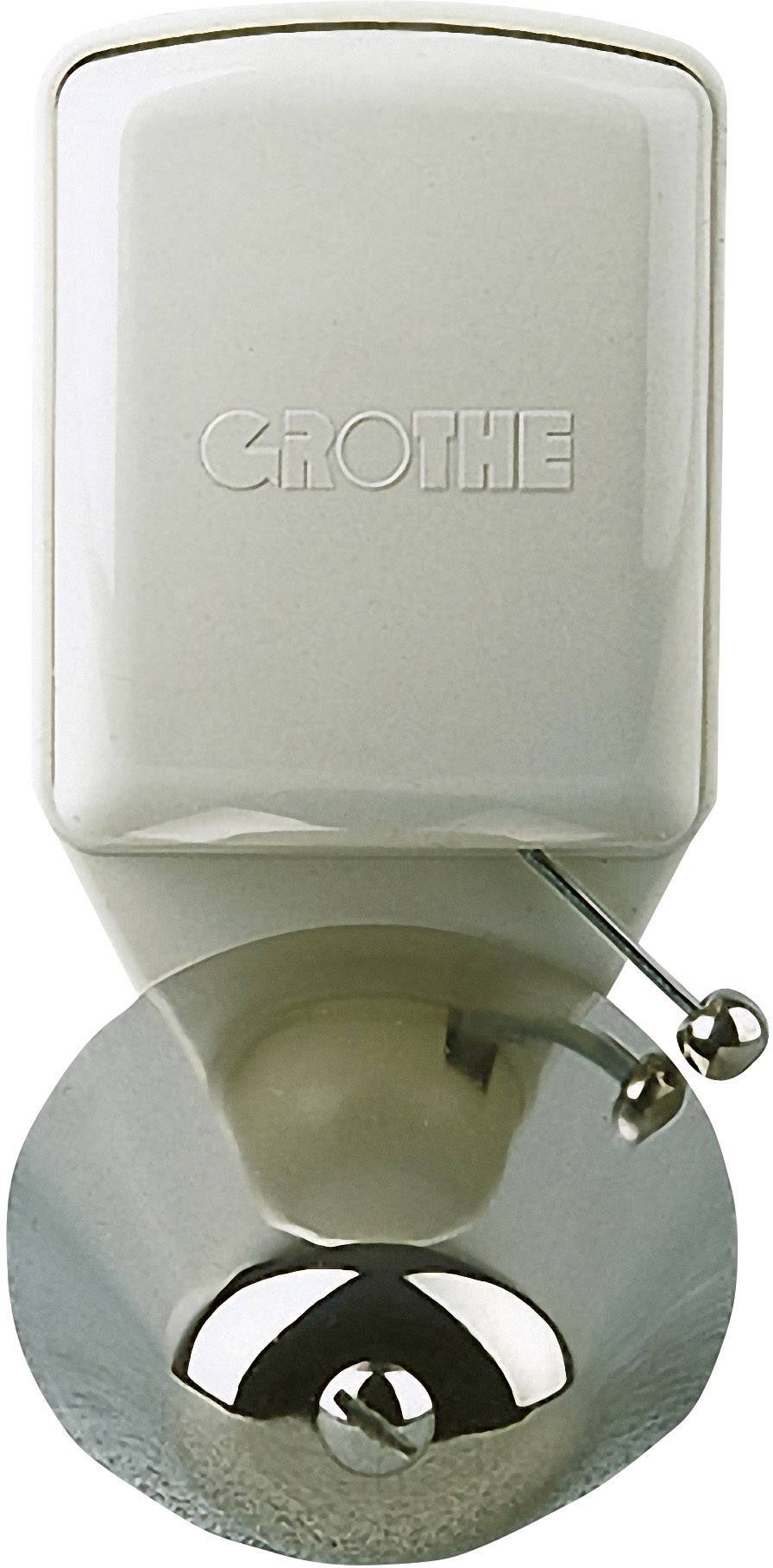 Bijeli, zidni dozator sapuna s natpisom 'CROTHE' i metalnom ručkom za doziranje.
