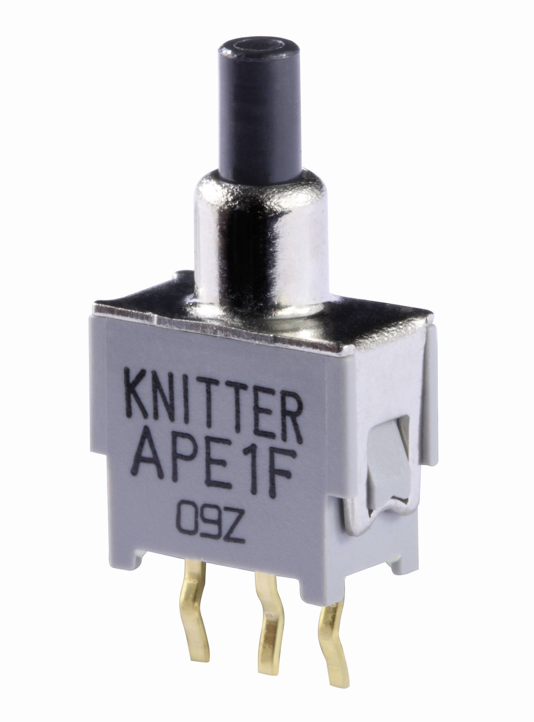 Mali preklopni prekidač na kojem piše 'KNITTER APE1F 09Z'. Ima dva metalna kontakta dolje i crnu plastičnu ručku gore.