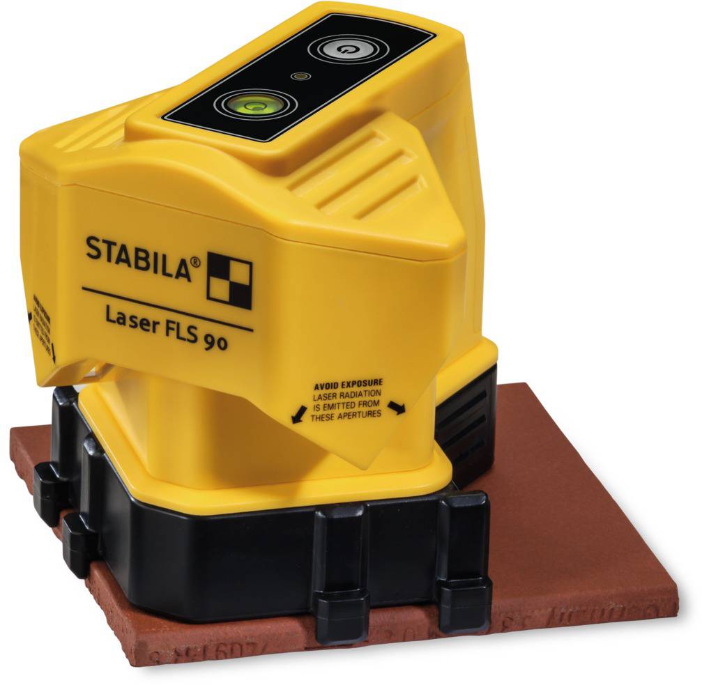 Egy sárga lézerszintező "STABILA Laser FLS 90" felirattal, egy piros padlócsempe felületén elhelyezve.