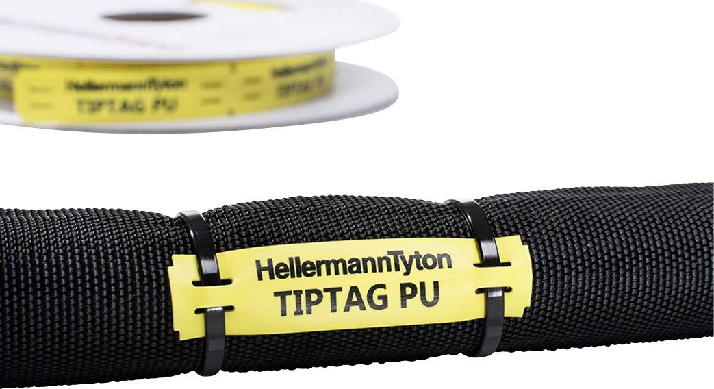 Egy sárga kábeljelölő, amelyen a 'HellermannTyton TIPTAG PU' felirat szerepel, egy fekete kábelen van elhelyezve.