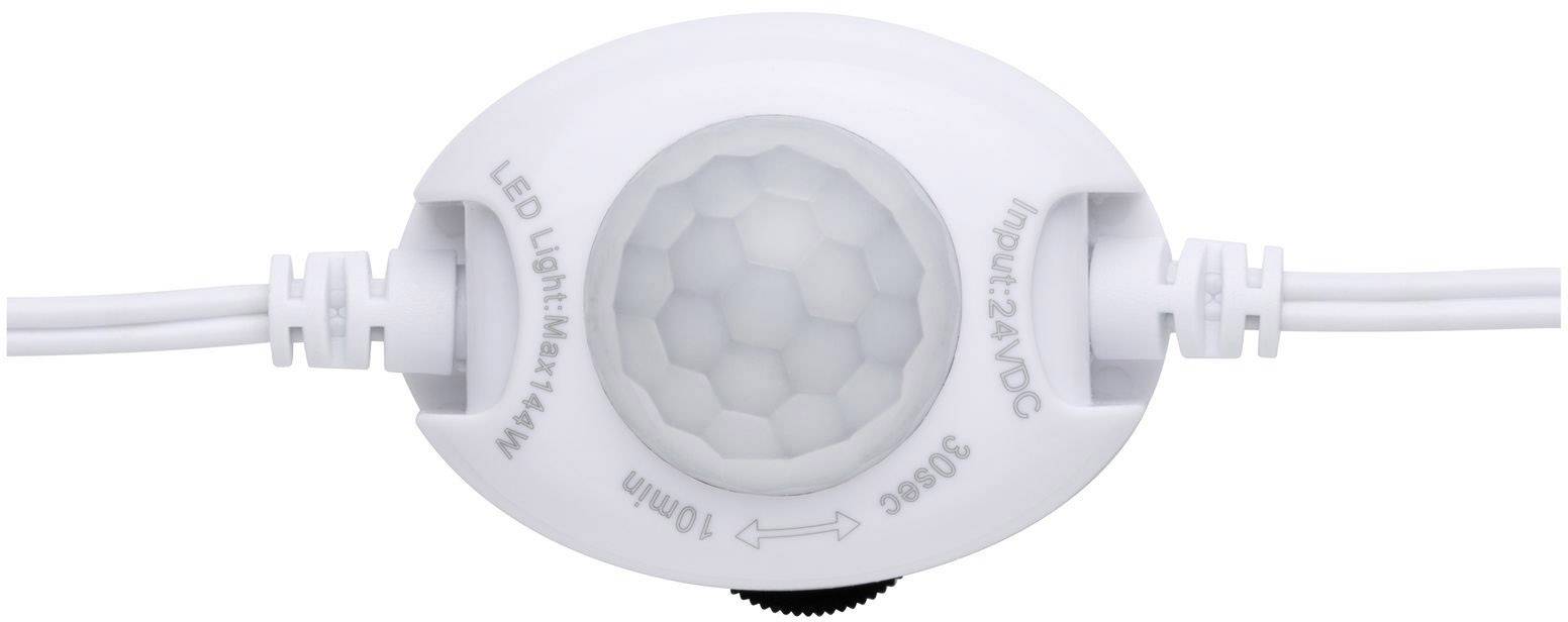 Egy fehér LED-mozgásérzékelő, amelyen a 'LED Light Max 144W Bemenet: 24VDC 360°C' felirat szerepel.