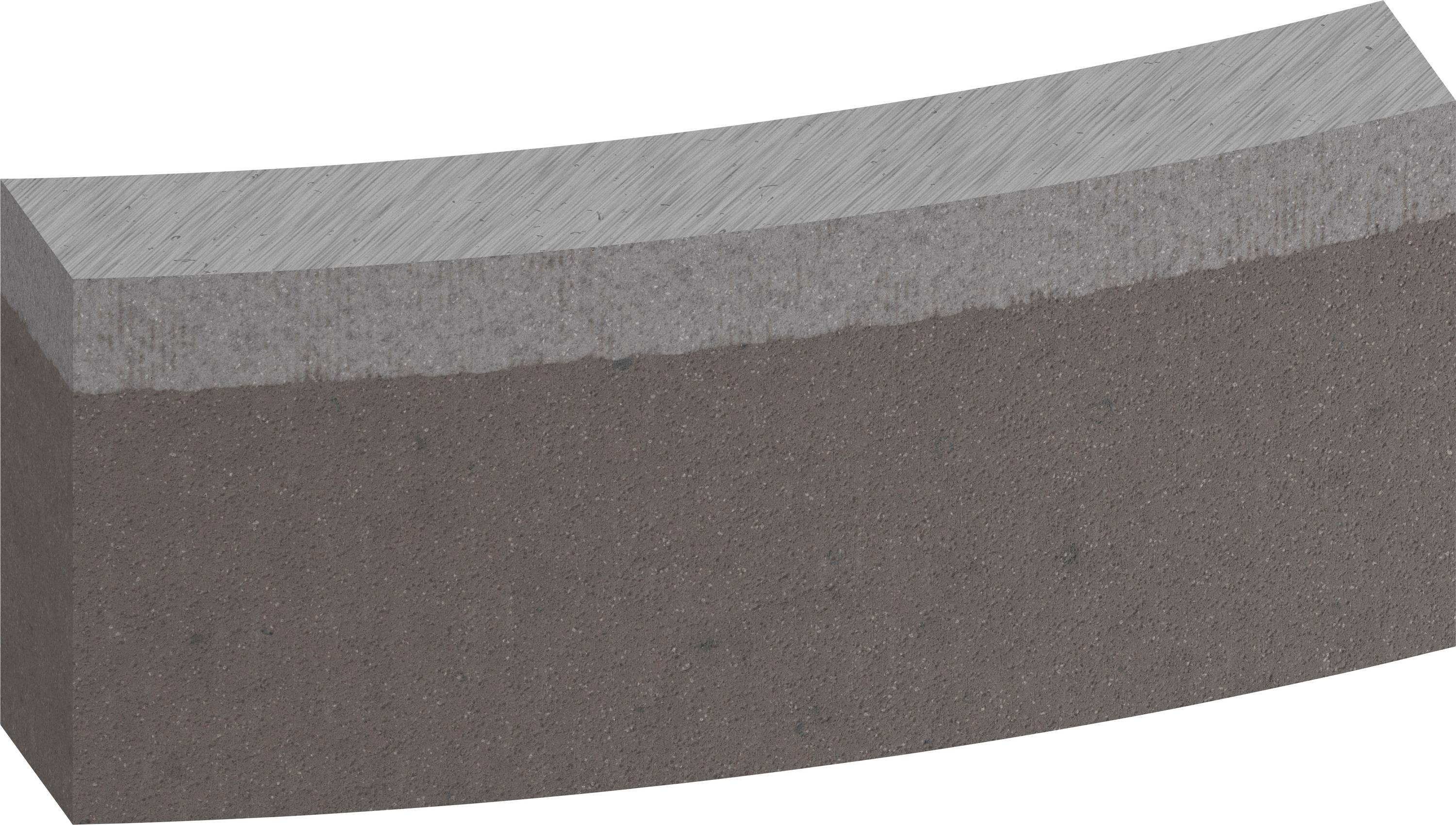 Félkör alakú szürke tömb, amely két eltérő árnyalatú rétegből áll. A felső réteg világosabb, mint a többi.