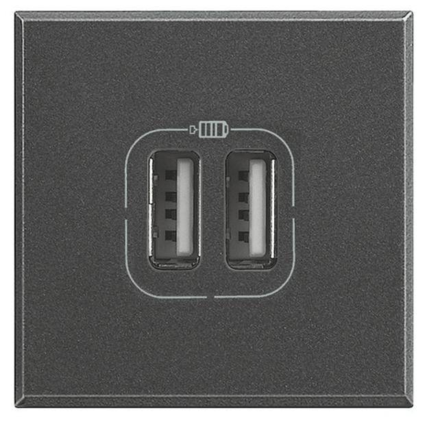 Fekete keretben lévő dupla USB-aljzat eszközök töltéséhez.