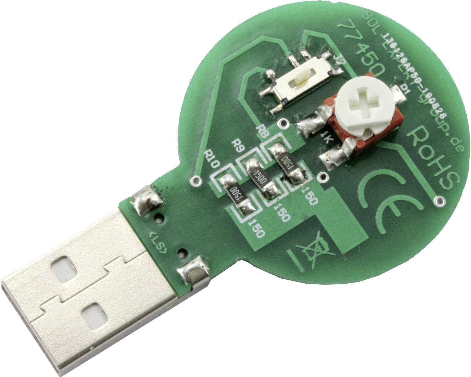 Egy kerek USB-dongle zöld áramköri lappal és elektronikai alkatrészekkel, köztük egy fehér kapcsolóval és több ellenállással.