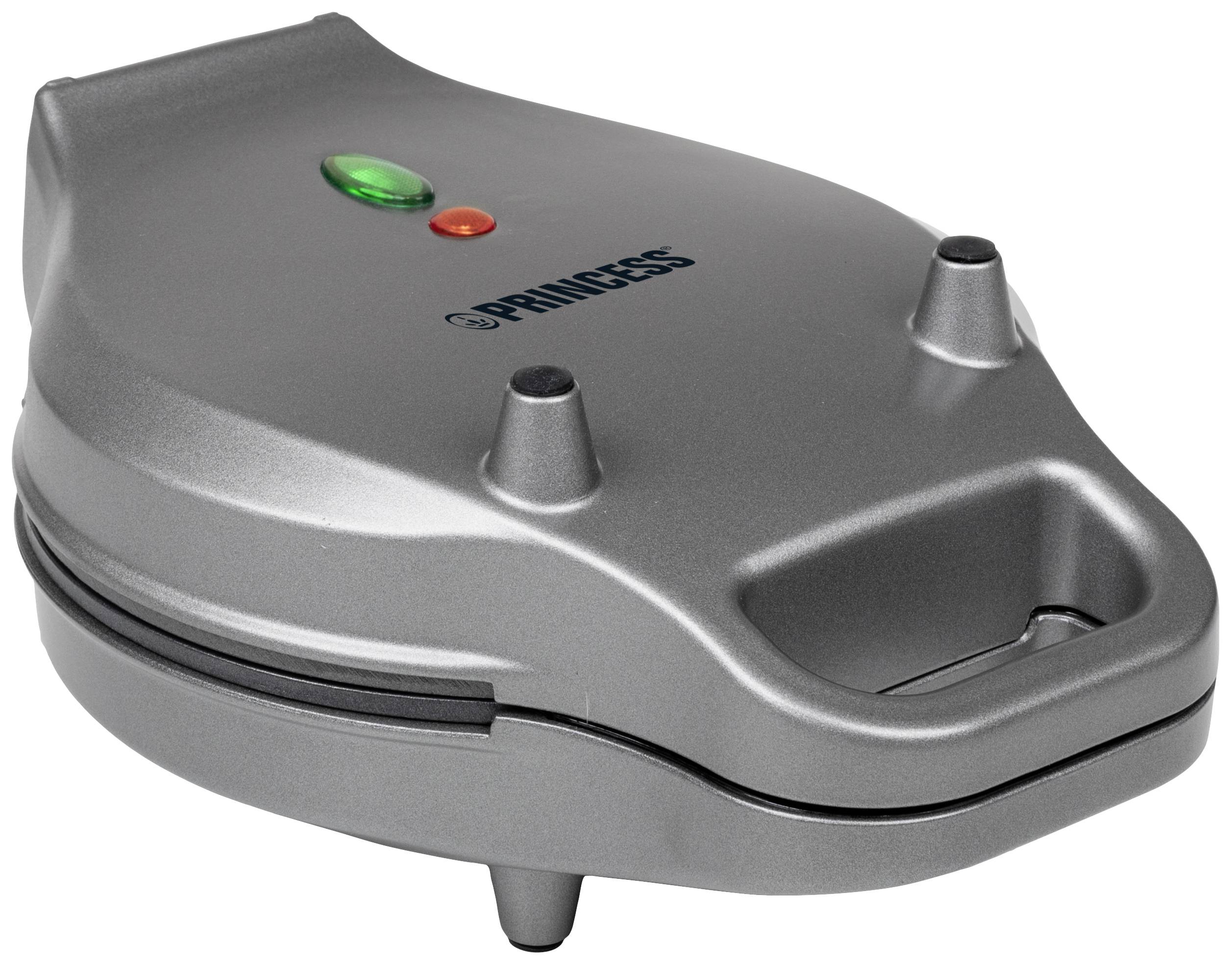 Egy ezüstszínű gofrisütő "Princess" felirattal. Két jelzőlámpa, egy zöld és egy piros, látható a tetején.