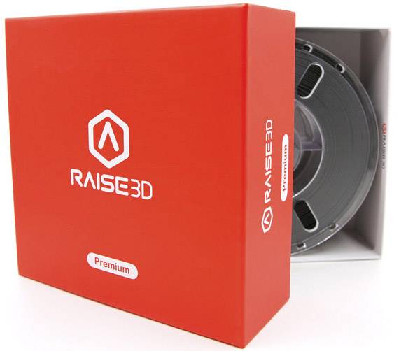 Piros csomagolás fehér 'RAISE3D' logóval és 'Prémium' címkével, benne egy fekete 3D-nyomtató filamenttekercssel.