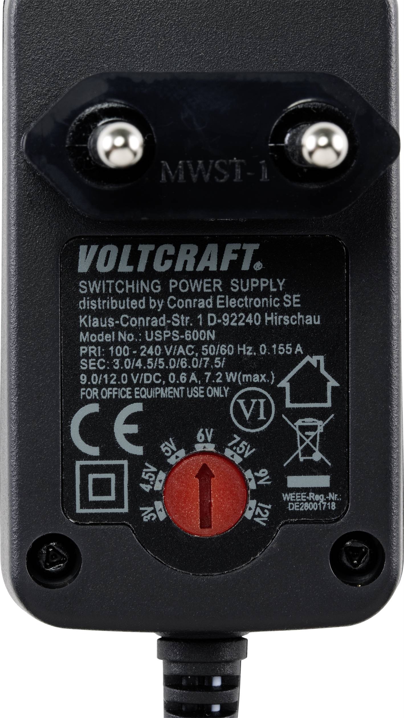 Fekete Voltcraft kapcsolóüzemű tápegység feszültségállítási lehetőséggel. Felirat a címkén: Modell, Bemeneti feszültség 100-240 V, Kimenetek 3-12 V.