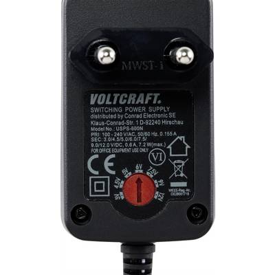 Fekete Voltcraft kapcsolóüzemű tápegység feszültségállítási lehetőséggel. Felirat a címkén: Modell, Bemeneti feszültség 100-240 V, Kimenetek 3-12 V.