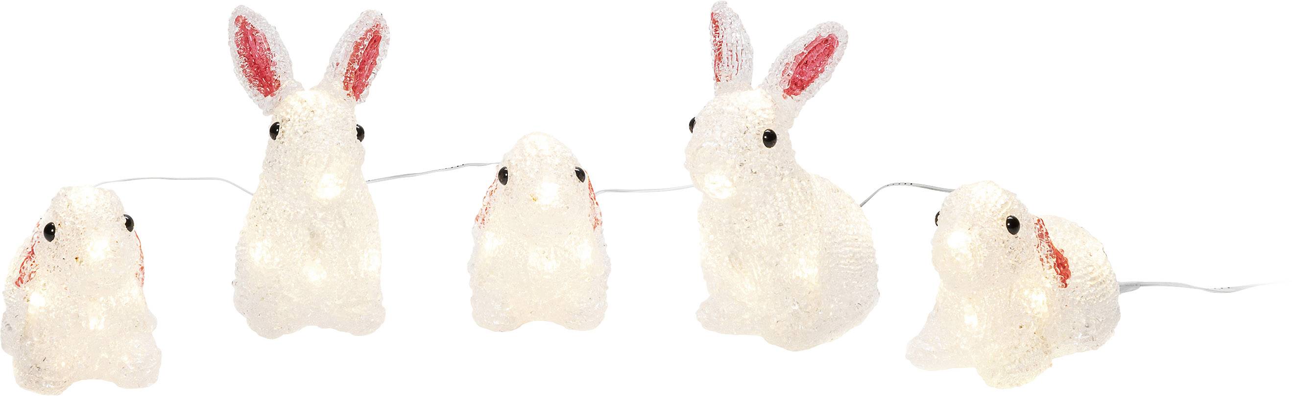 Fehér nyuszis fényfüzér öt világító nyúlfigurával, rózsaszín fülekkel és fekete szemekkel. Dekoratív megvilágításként szolgál.