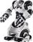 Egy fehér-fekete robot áll egyenesen, csuklós karokkal és lábakkal. A dizájn futurisztikus és mechanikus.