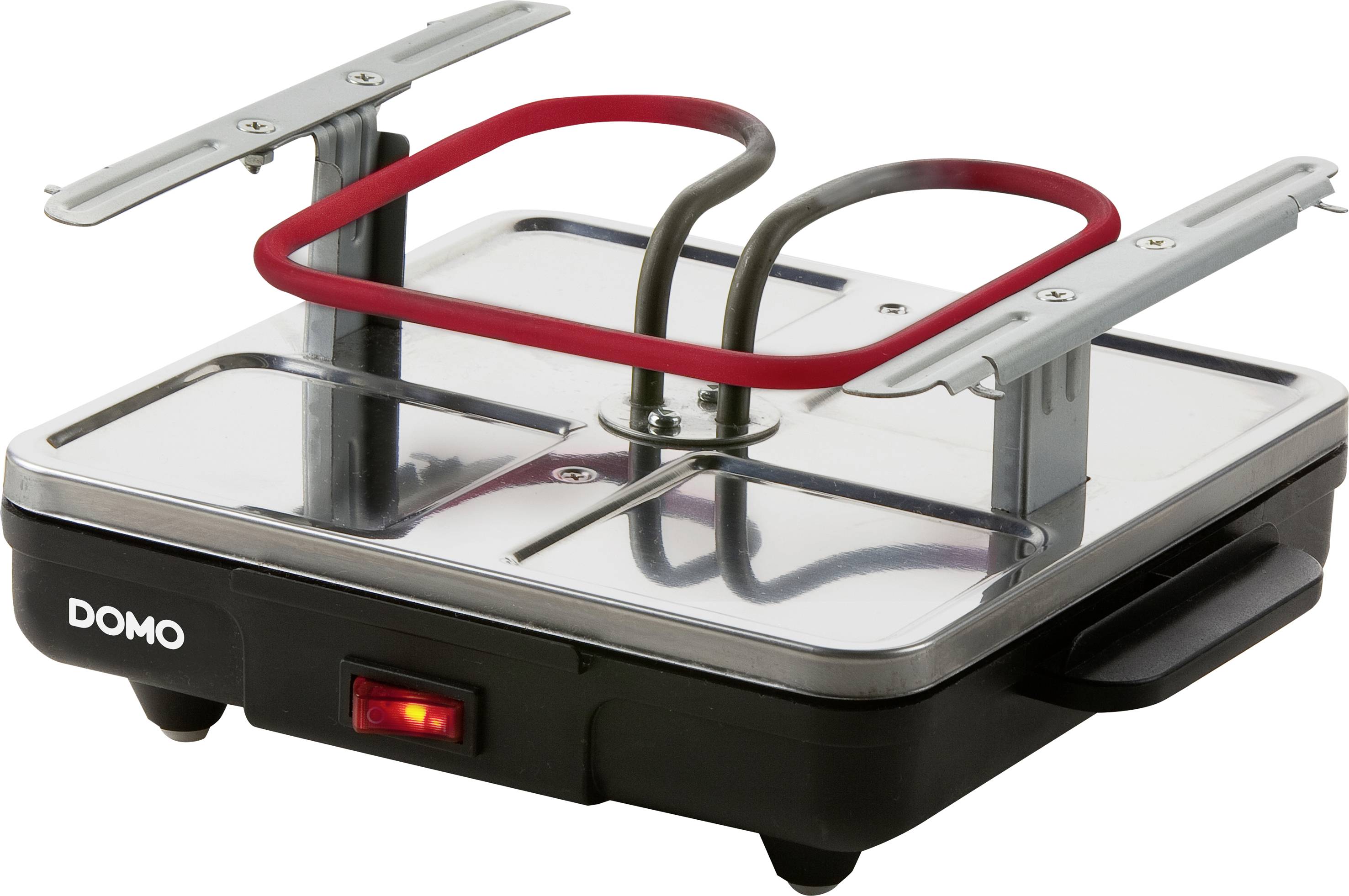 Egy fekete-ezüst szendvicssütő piros fűtőelemmel fényes felületen. A megvilágított kapcsoló jelzi az üzemmódot.