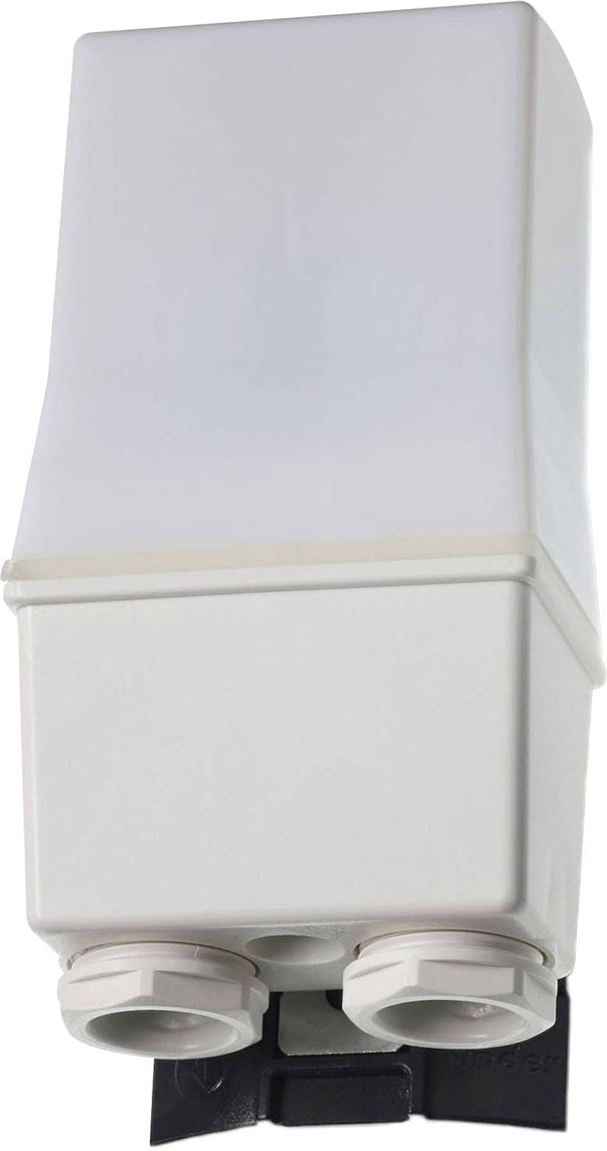 Egy téglalap alakú házú elektronikai alkatrész, két kábelbevezető nyílással alul, valószínűleg műszaki telepítésekhez.