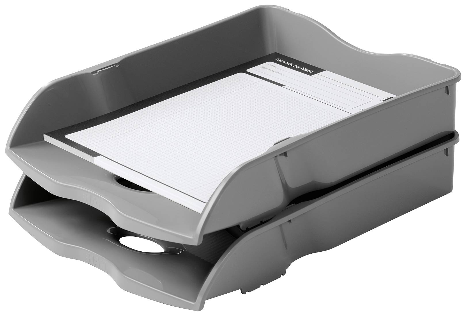 Két egymásra helyezett szürke irattartó kosár, amelynek felső rekeszében egy vonalas füzet vagy papírblokk található.