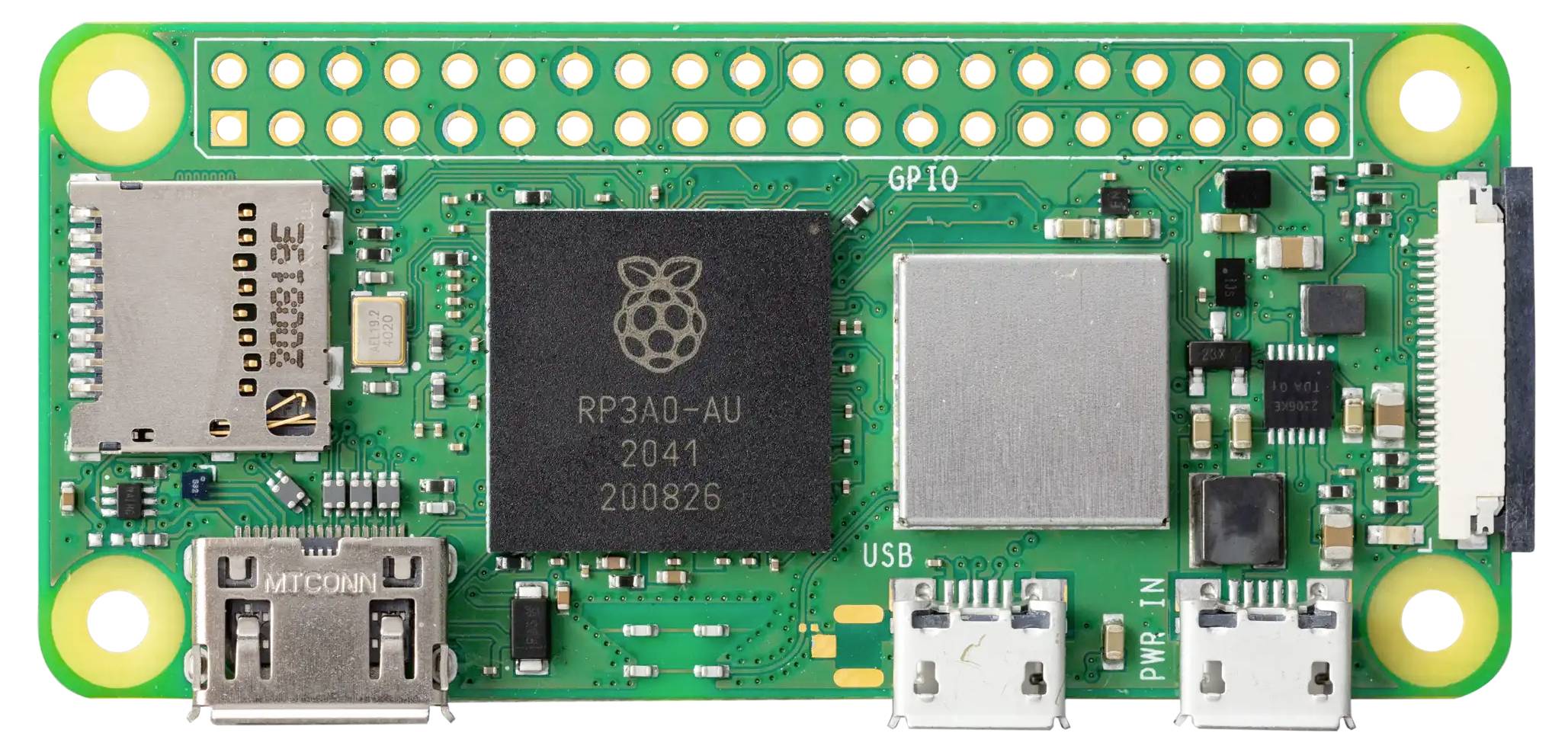 Egy Raspberry Pi Zero 2 W, egy kis zöld áramköri lap processzorral és USB-csatlakozókkal, kiválóan alkalmas kompakt elektronikai projektek megvalósítására.