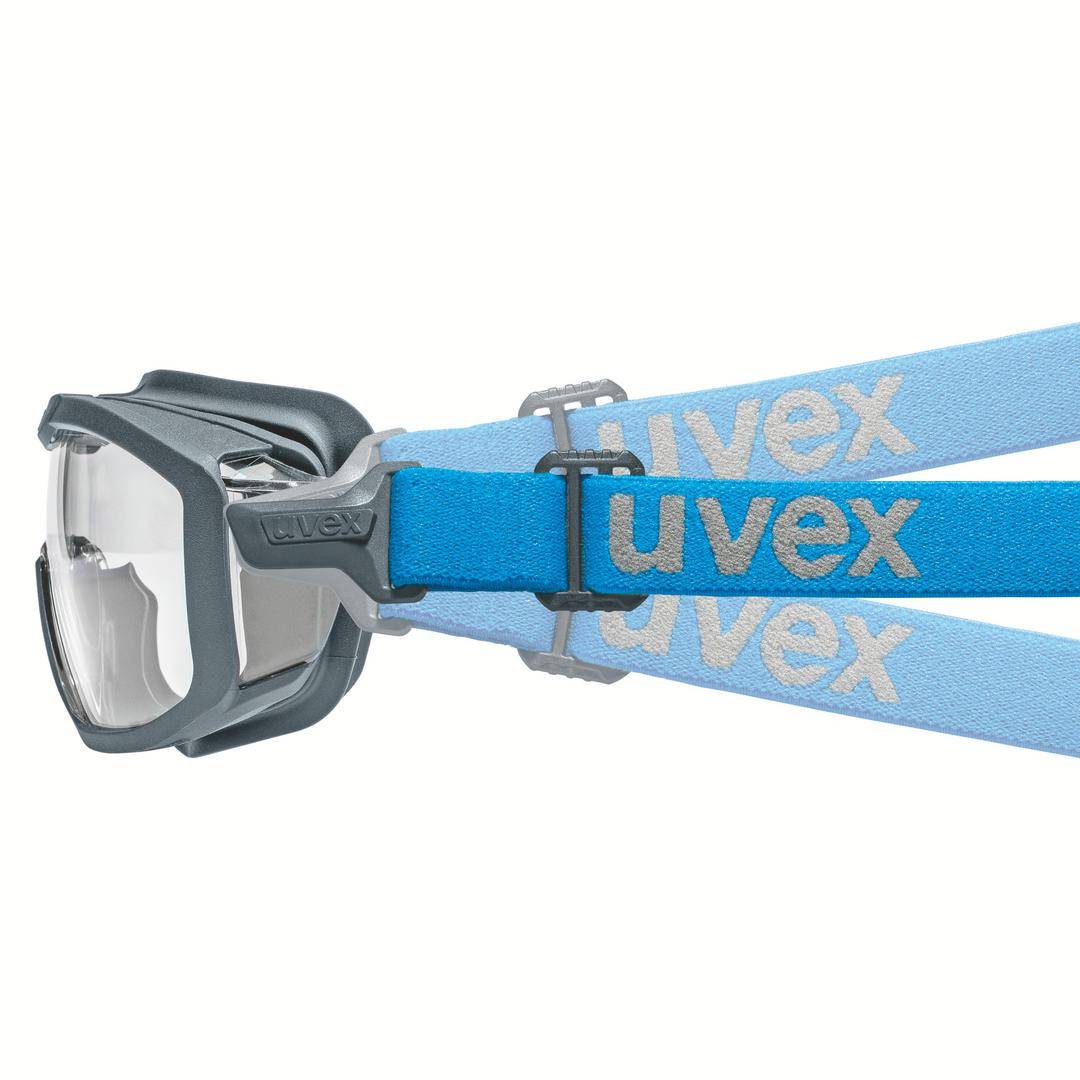 Szürke keretű védőszemüveg állítható kék pánttal. A 'uvex' márkanév a pántba nyomva.