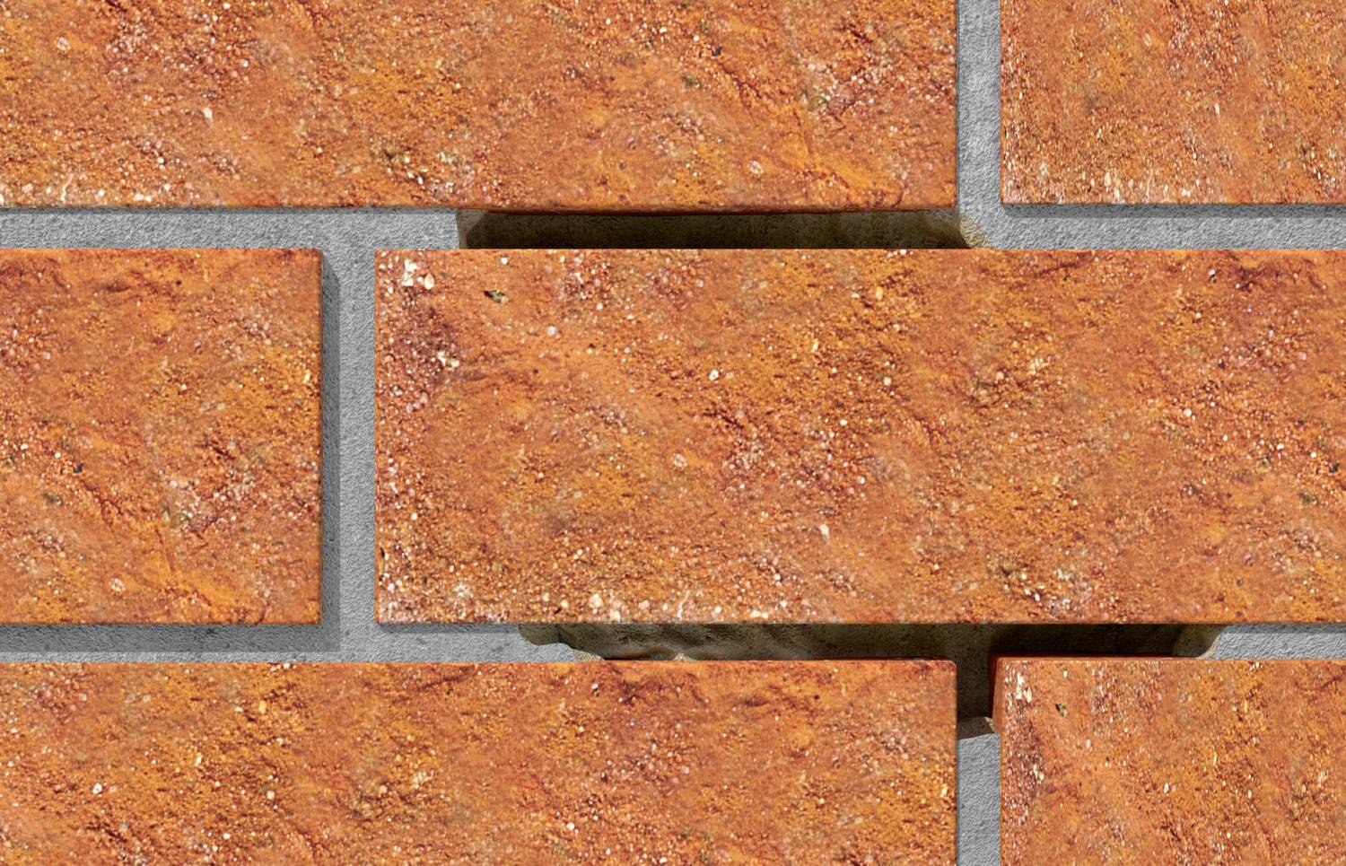 Egy tégla közeli felvétele, amelyből a középső tégla hiányzik, feltárva a mögötte lévő cementet és az árnyékot.