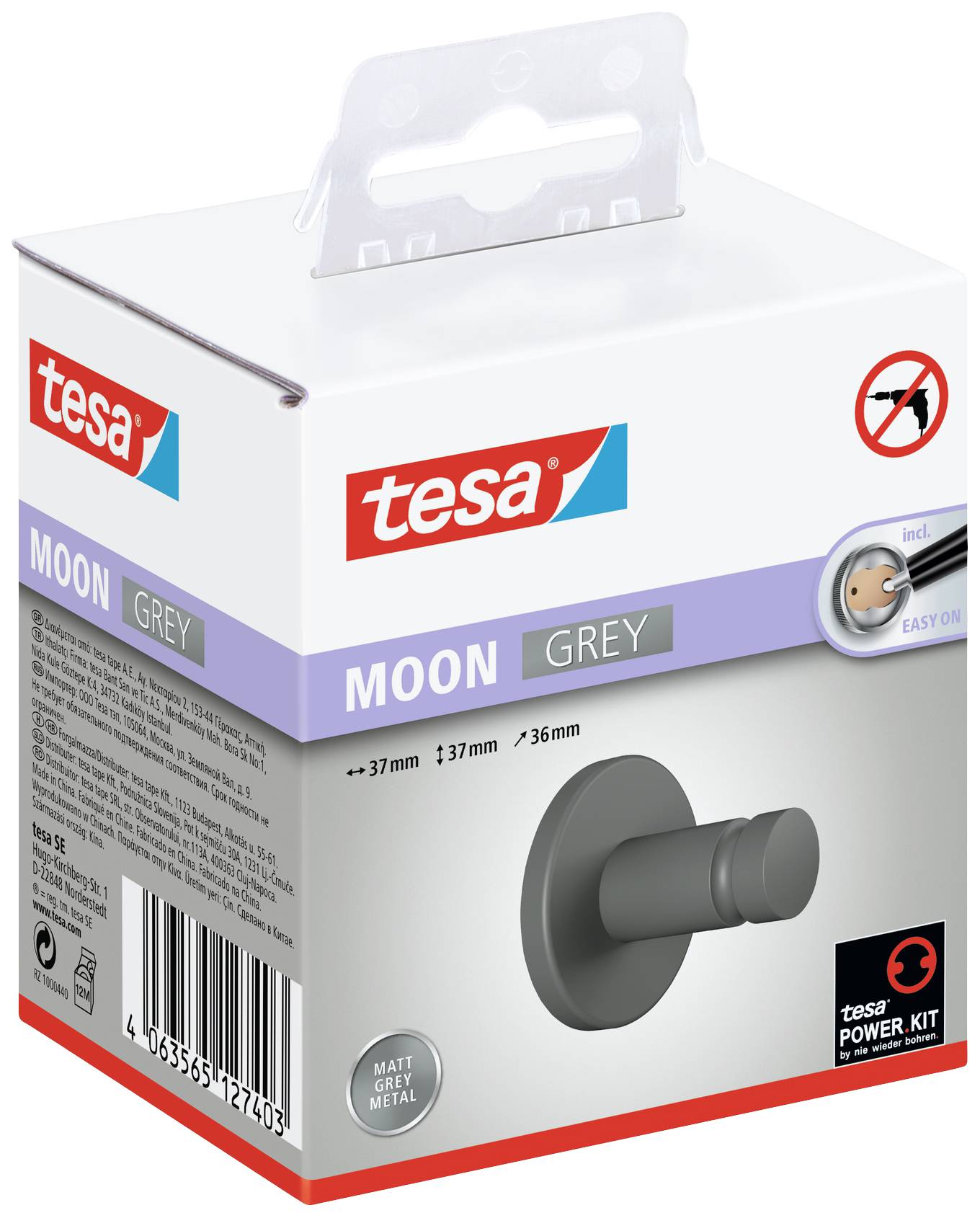 Egy Tesa Moon Grey öntapadós akasztó csomagolása, amely fúrás nélkül rögzíthető. A csomagon az akasztó képe és a csomagolási szöveg látható.