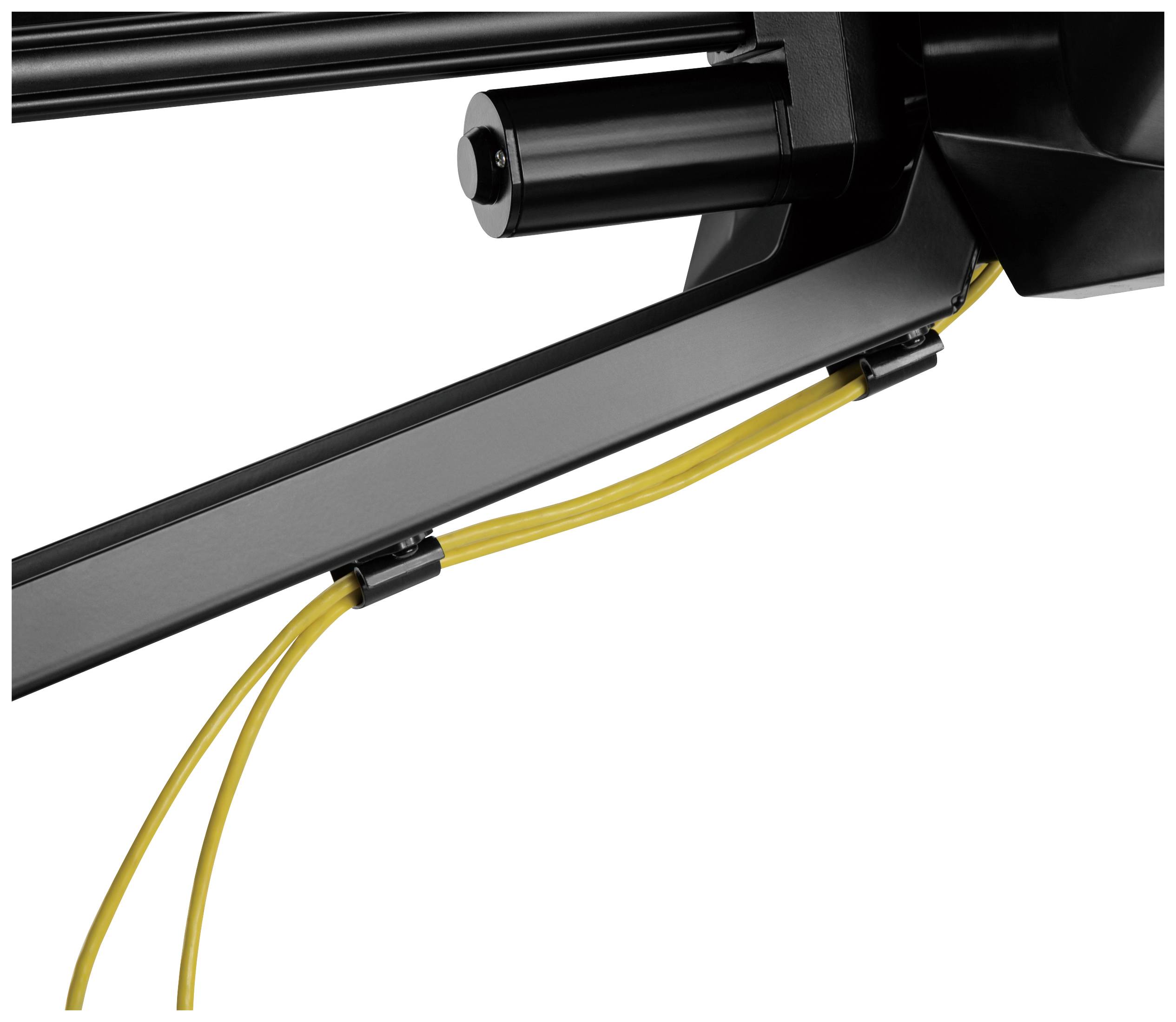 Egy fekete mechanizmus sárga kábelekkel, amelyek rögzítve vannak rajta.