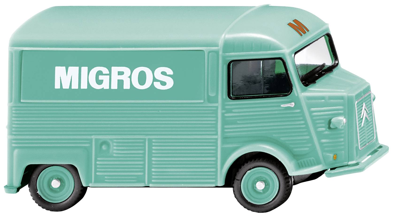 Egy türkizzöld játékautó, teherautó formájában, amelyen a 'Migros' felirat szerepel.