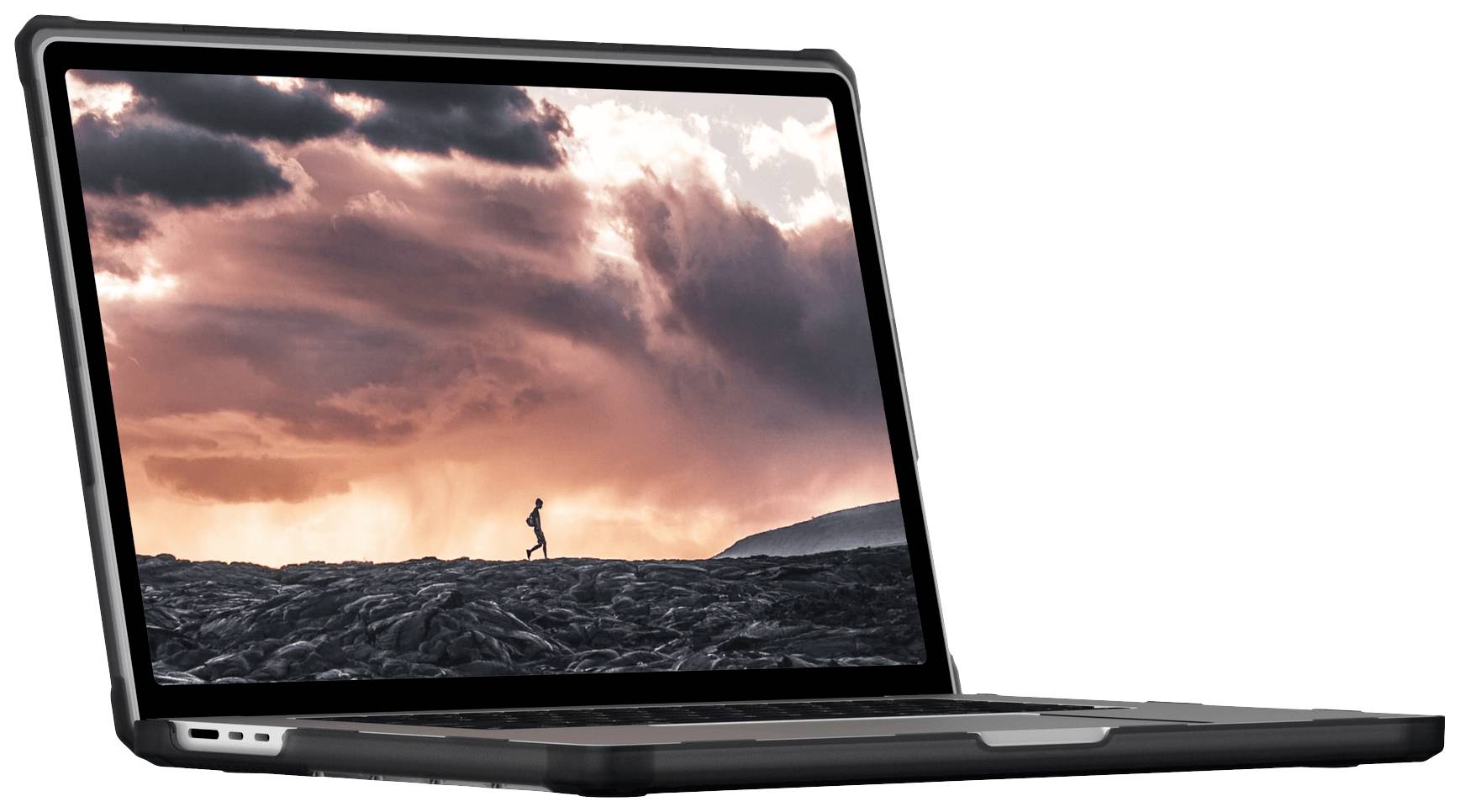 Egy laptop képernyőjén egy személy látható, amint naplemente idején egy sziklás tájon fut.