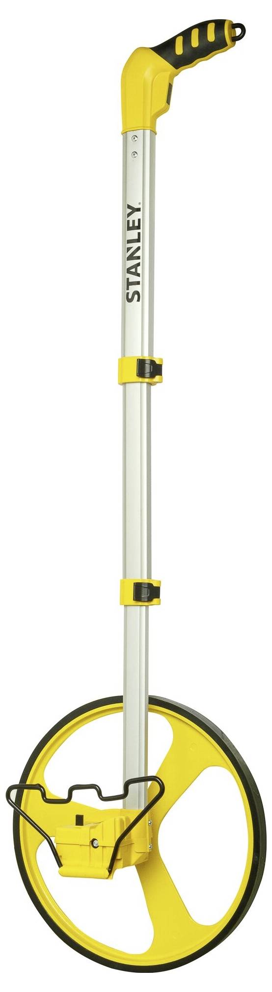 Egy sárga mérőkerék fekete fogantyúval, amelyet távolságok mérésére használnak. A 'Stanley' márkanévvel van megjelölve.