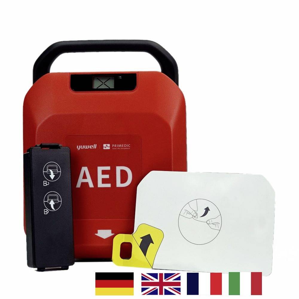 Hordozható piros AED-defibrillátor, kinyitva elektródákkal és több nyelvű (német, angol, francia, olasz) útmutatásokkal.