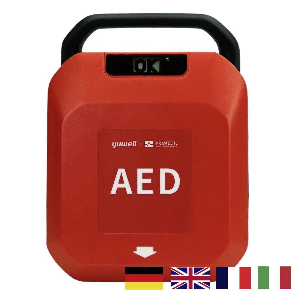 Egy piros AED-készülék 'OK' kijelzővel felül. Kis zászlók Németország, Nagy-Britannia, Franciaország és Olaszország jelképével alul.