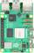 Egy zöld Raspberry Pi 5 alaplapot több csatlakozóval és chippel, beleértve a HDMI és USB csatlakozókat.