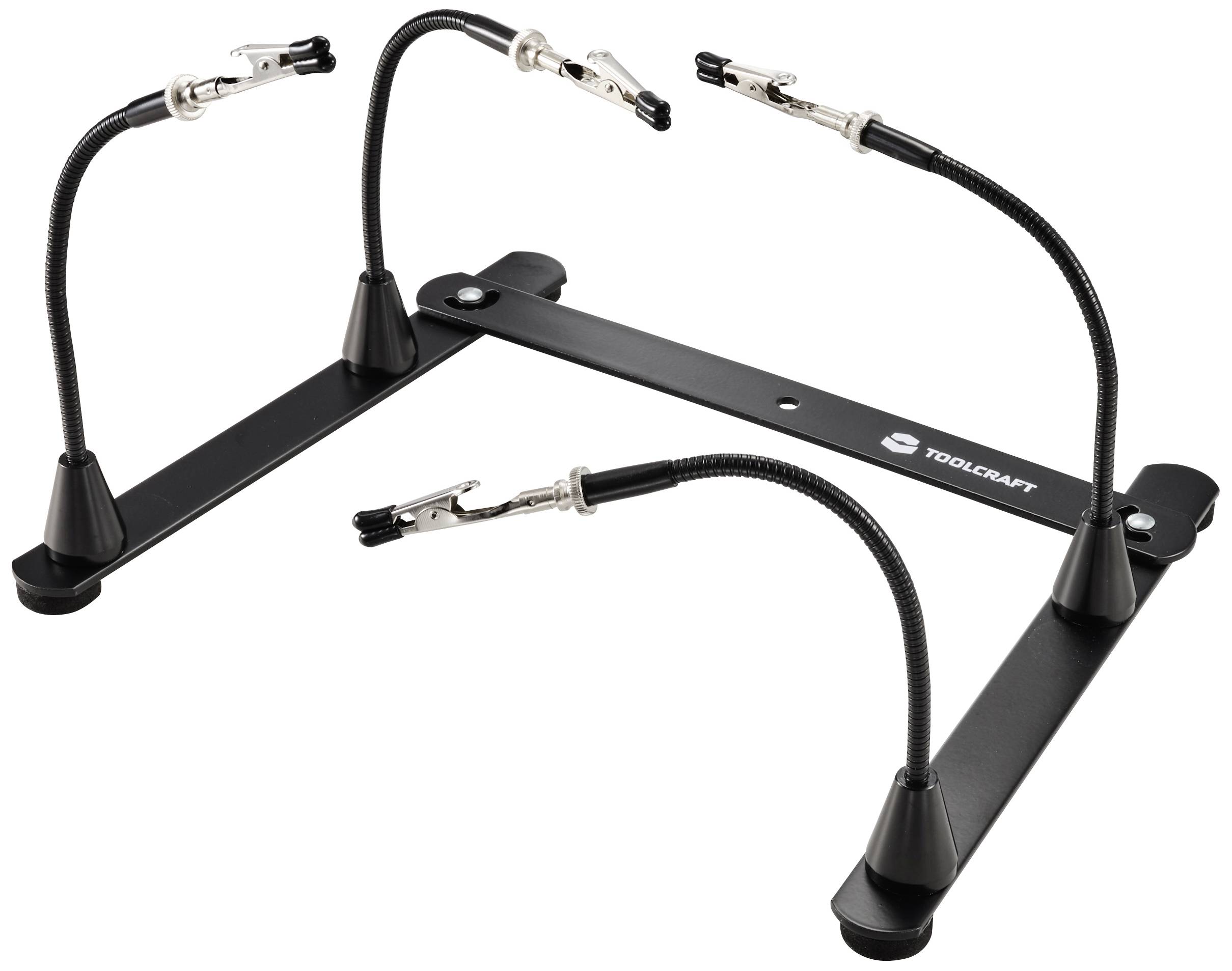 Egy fekete tartó négy hajlékony karral és szorítóval. Alkalmas alkatrészek rögzítésére munkák vagy bemutatók során.
