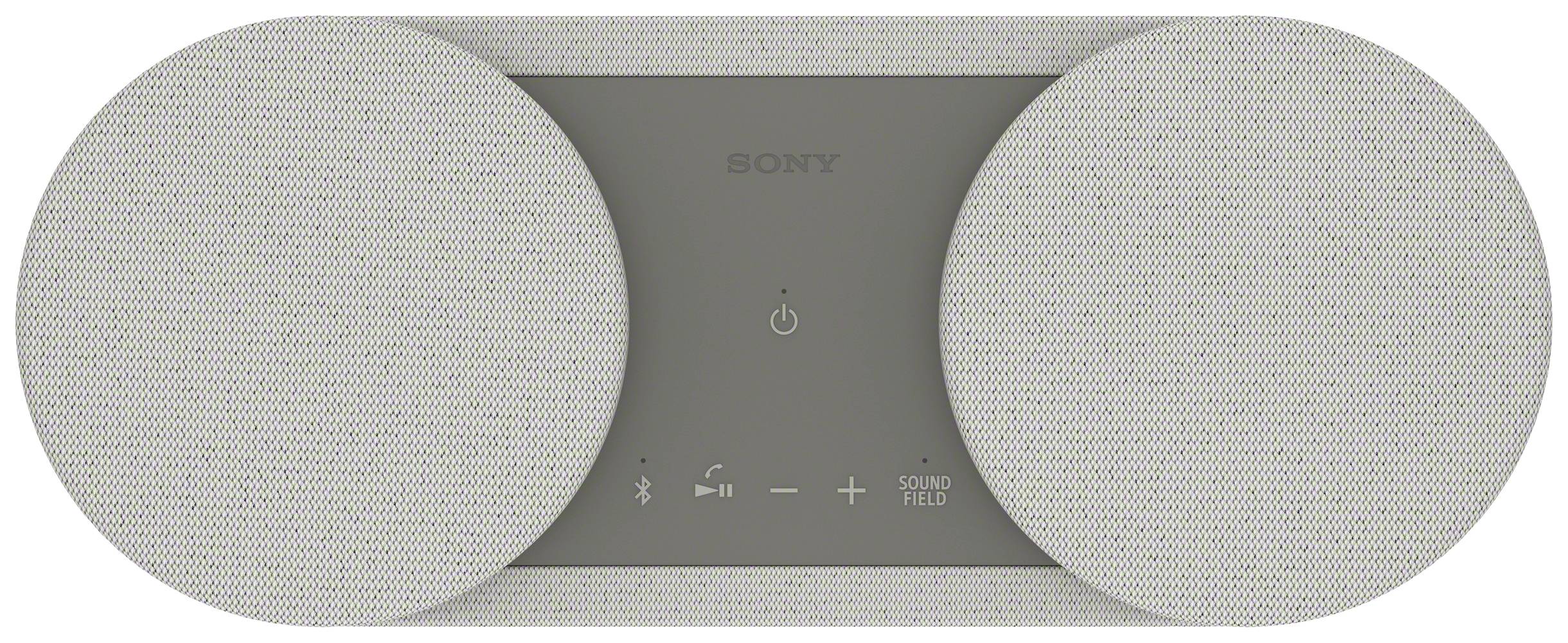 Egy modern, fehér hangszórórendszer két kerek hangszóróval. A közepén kezelőszervek és egy be/ki kapcsoló szimbólum található.